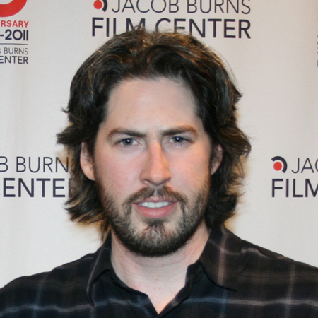 Jason Reitman headshot in front of Jacob Burns Film Center banner