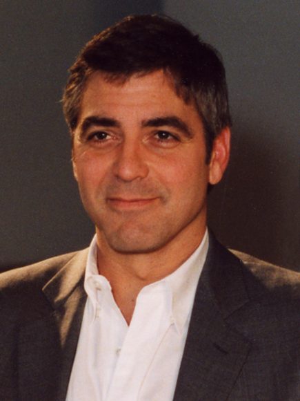 George Clooney portrait from chest up in grew suitcoat and white shirt