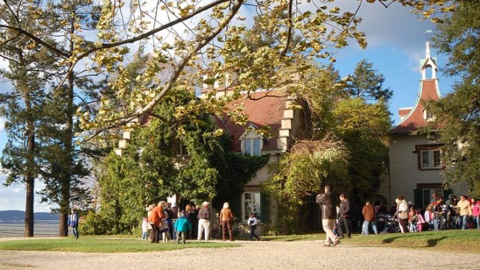 Historic Hudson Valley house with people outside