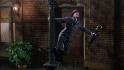 Gene Kelly dancing on light post in rain